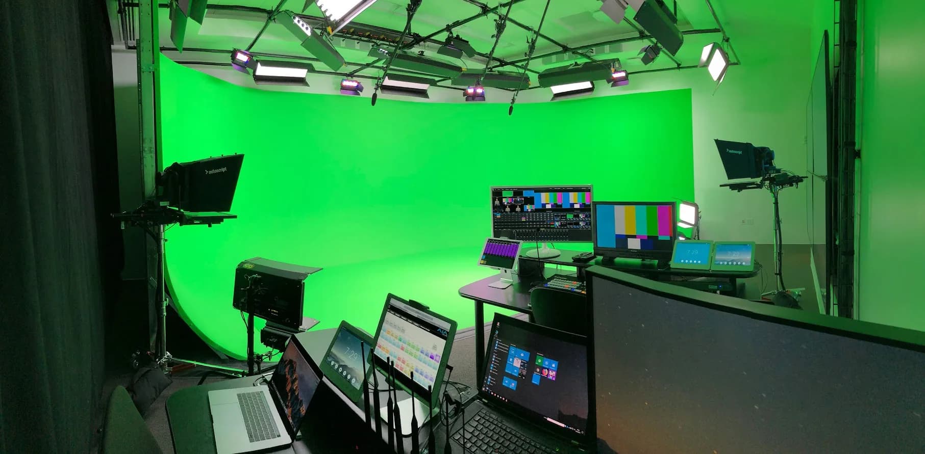 Completed Cisco San Jose studio with overhead lighting, camera systems, confidence monitors, and control desk
